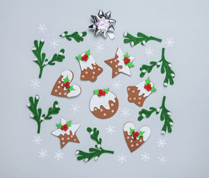 Directly above shot of christmas decorations on white background