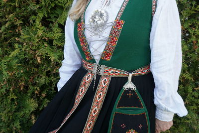 Midsection of woman wearing traditional clothing 