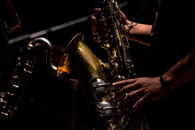 Midsection of man playing at music concert