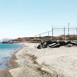 Scenic view of beach against clear sky