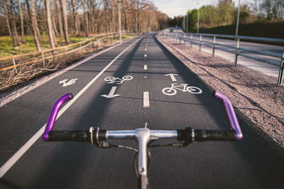 Close-up of bicycle on road