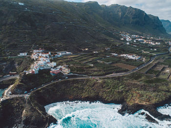 High angle view of river amidst mountains