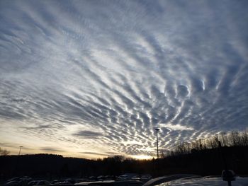 Scenic view of silhouette landscape against sky during winter