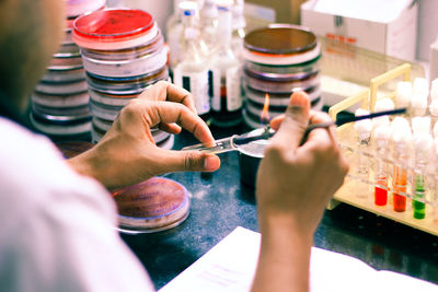 Close-up of person hands experimenting in laboratory