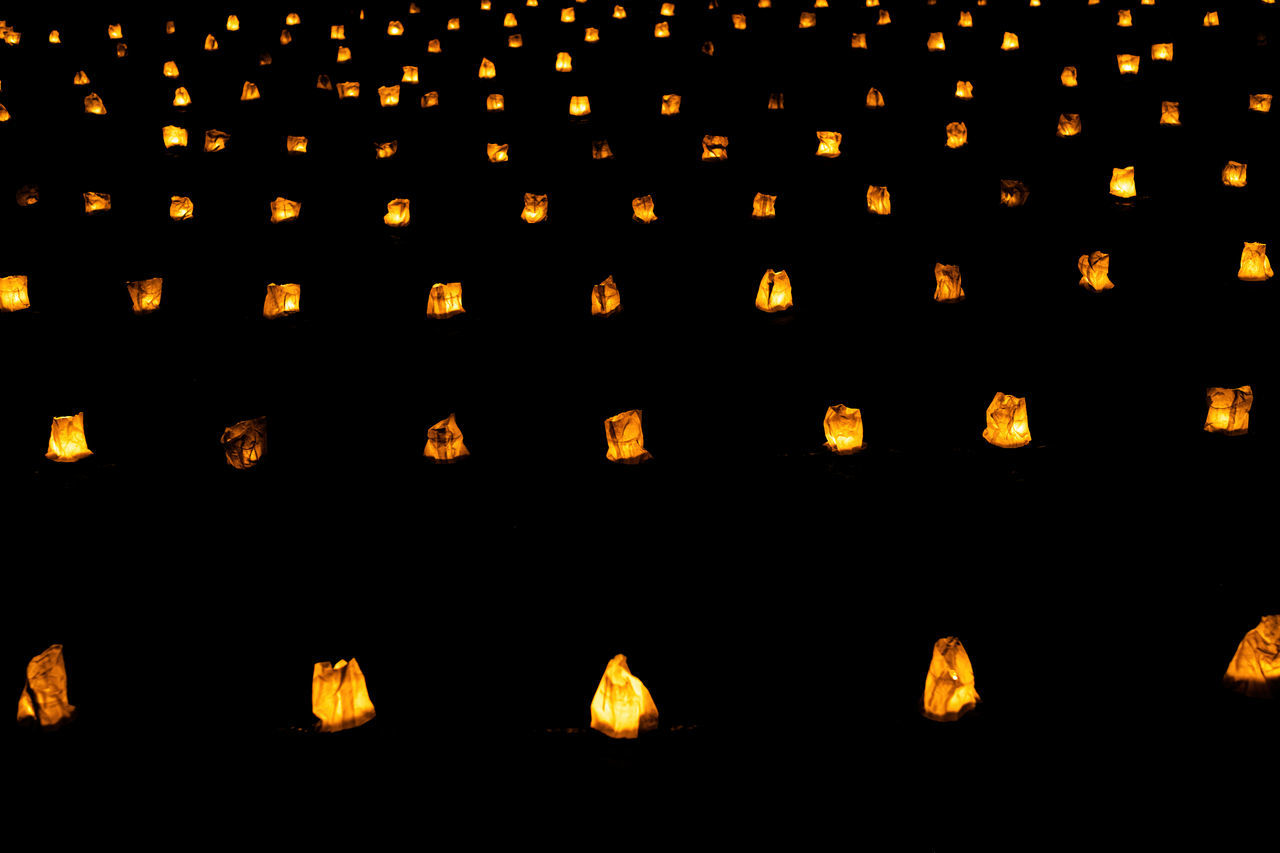 font, large group of objects, no people, in a row, illuminated, lighting equipment, backgrounds, abundance, circle, yellow, repetition, night, full frame