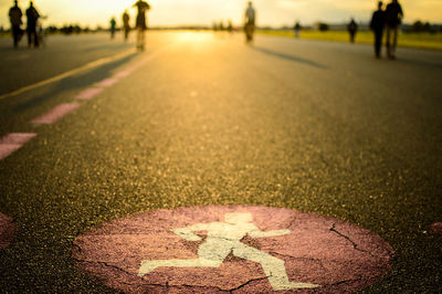 Close-up of road walking on street at night