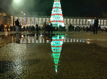 Illuminated christmas tree at night