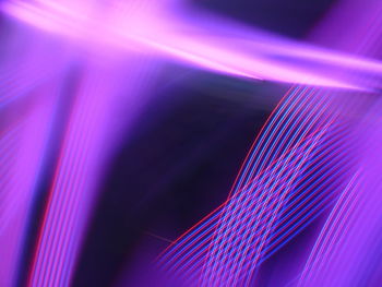 Close-up of light painting against black background