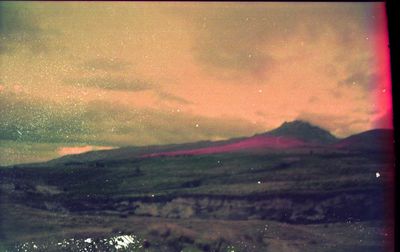 Scenic view of mountains against dramatic sky