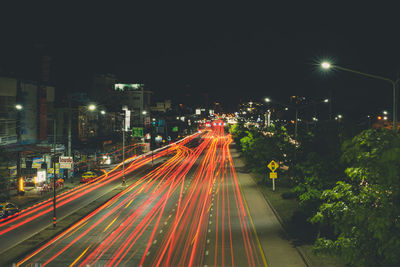 Light trails on street in city at night