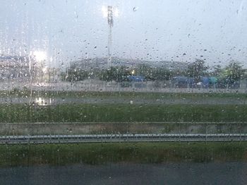 Raindrops on glass window in rainy season