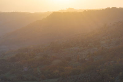 Scenic view of mountains in foggy weather