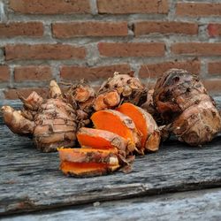 Close-up of mushrooms on wooden wall