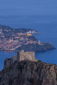 Scenic view of sea and buildings against sky