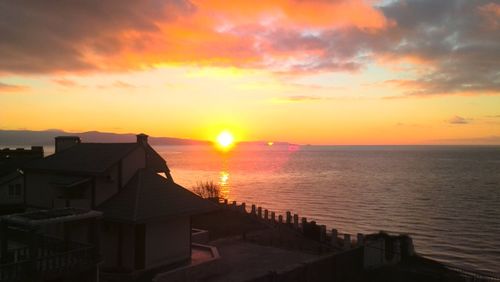 Scenic view of sea against orange sky