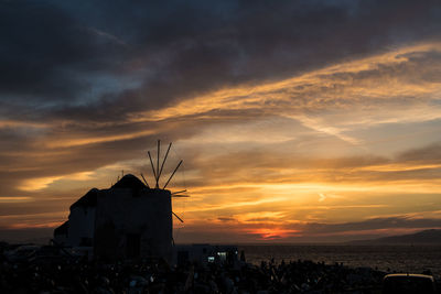 Silhouette buildings against sky during sunset