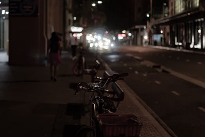 Bicycle on road in city at night
