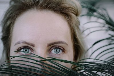 Close-up portrait of woman with gray eyes