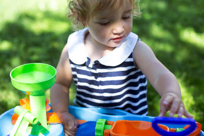 Cute boy playing with toy