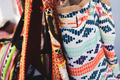 Clothes hanging at market stall for sale