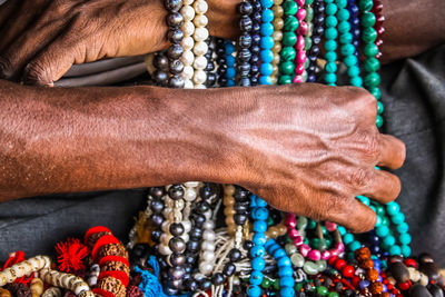 Close-up of man selling jewelry outdoors
