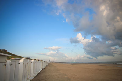 Scenic view of beach against blue sky