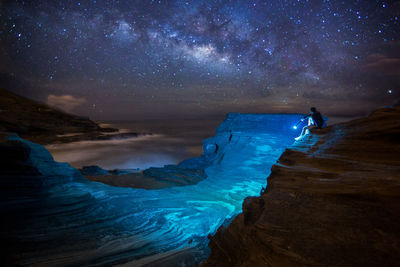 Scenic view of sea against sky at night