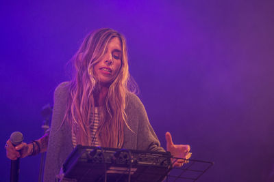 Low angle view of human face against sky at night
