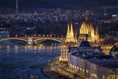 Illuminated buildings in city at night