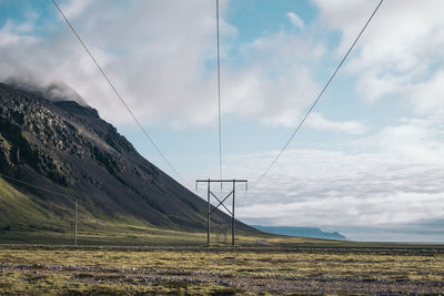 Scenic view of landscape against cloudy sky