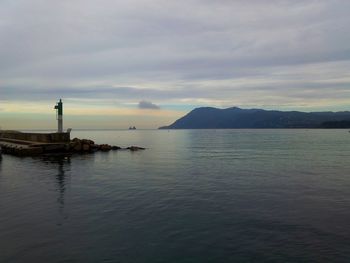 Scenic view of sea against cloudy sky