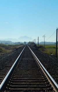 Railroad tracks against clear sky