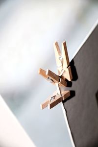 Close-up of cross hanging against wall