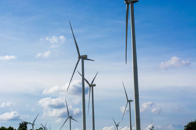 Low angle view of windmill against sky