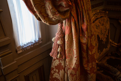 Close-up of window curtain hanging at home