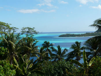 Scenic view of sea against blue sky