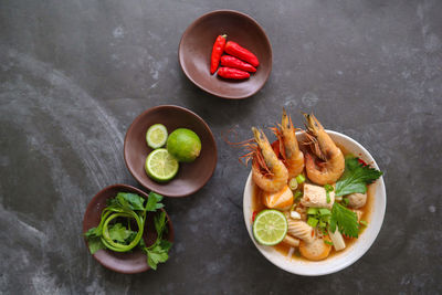 Tom yam soup originating from thailand. tom yum is made with shrimp, chili, lime, chicken, fish, .
