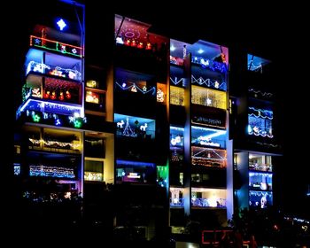 Illuminated buildings in city at night