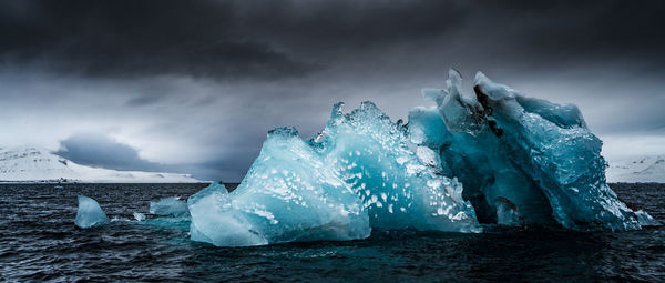 Scenic view of frozen sea against sky