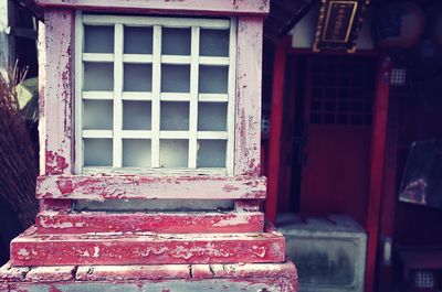 Close-up of old window of abandoned building