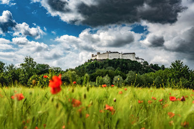 Fortress hohensalzburg in salzburg, austria under dramatic sky.