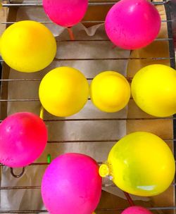 Close-up of multi colored balloons hanging on floor