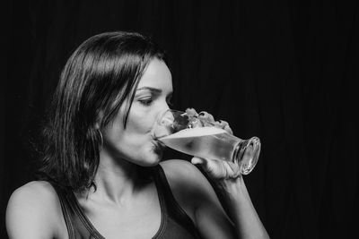 Side view of woman drinking water
