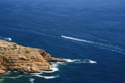 High angle view of rocks by sea