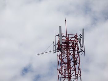 Low angle view of communications tower against sky