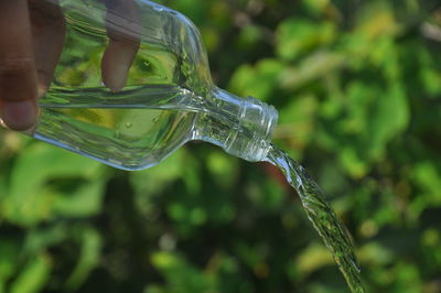 Close-up of pouring water from bottle