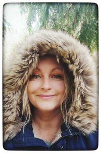 Portrait of a smiling young woman in winter