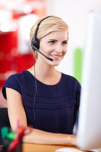 Female customer care representative working at office