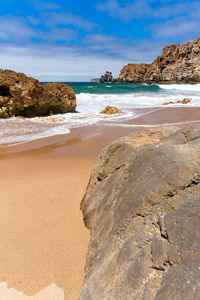 Scenic view of beach against sky