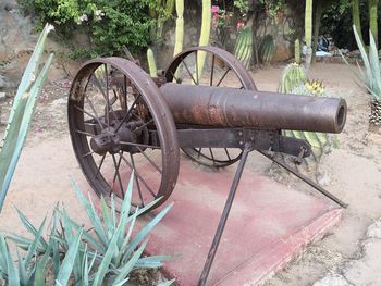 Old bicycle wheel on field